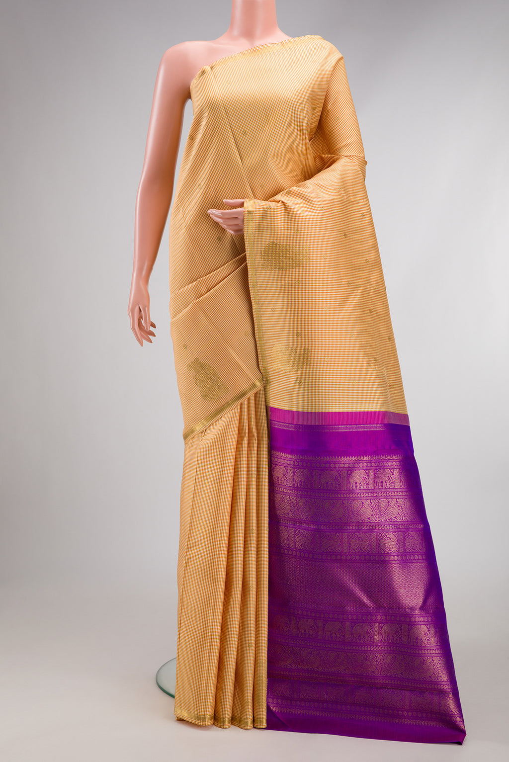 Pure Silk Pure Zari Sandal Kanchipuram Saree with Checked design on the body and Zari Border.  displayed on a mannequin