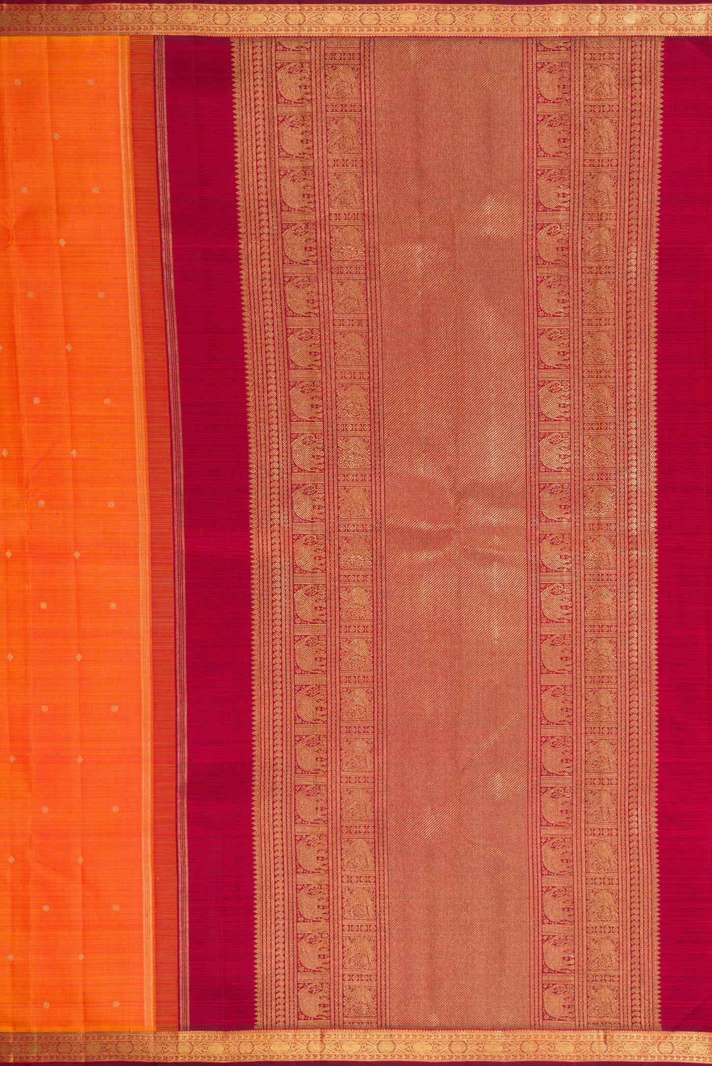 Close up image of the pallu of Orange Dual Tone Kanchipuram Silk Saree with Zari Butta on the body and Zari Border. 