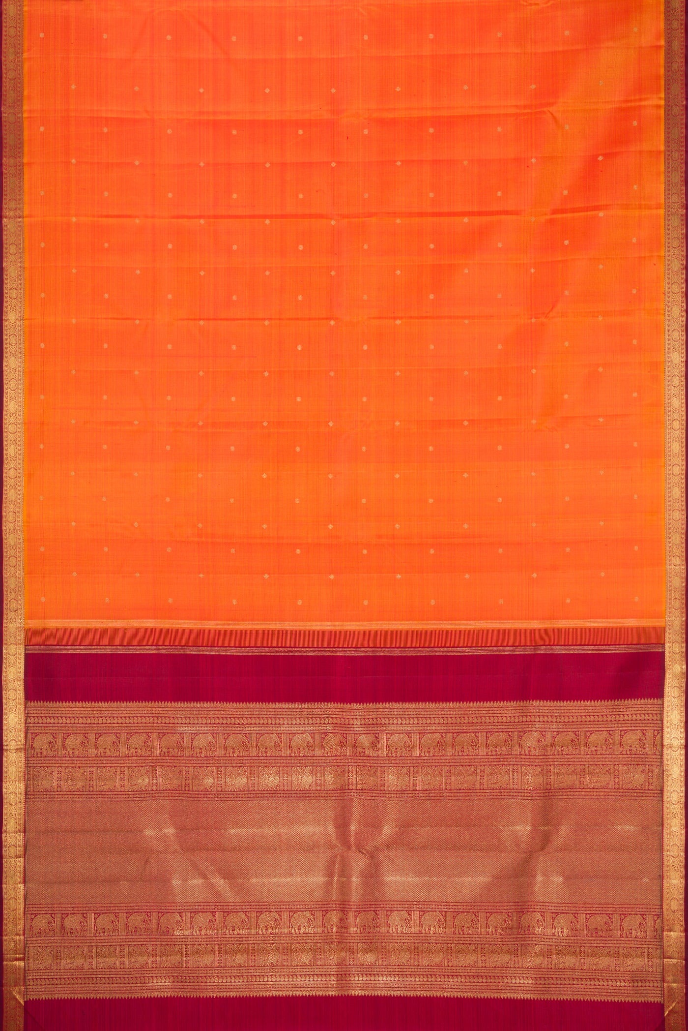 Flat view of Orange Dual Tone Kanchipuram Silk Saree with Zari Butta on the body and Zari Border. 