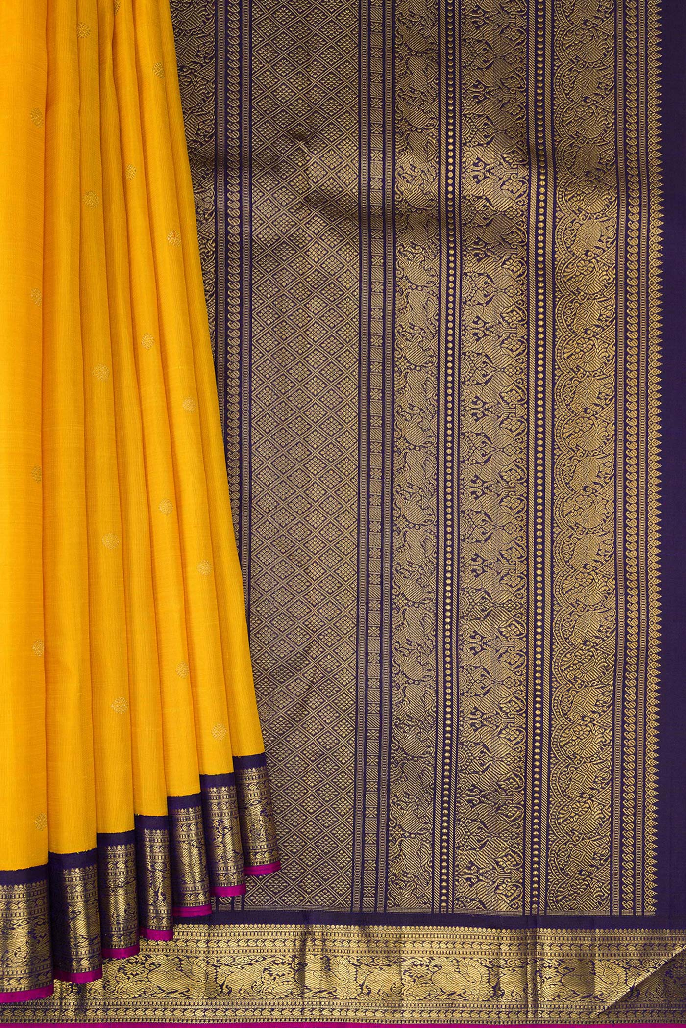 Pleats and pallu of Pure Silk Pure Zari Yellow Dual Tone Kanjivaram Saree with Zari Butta on the body and Zari Border. 