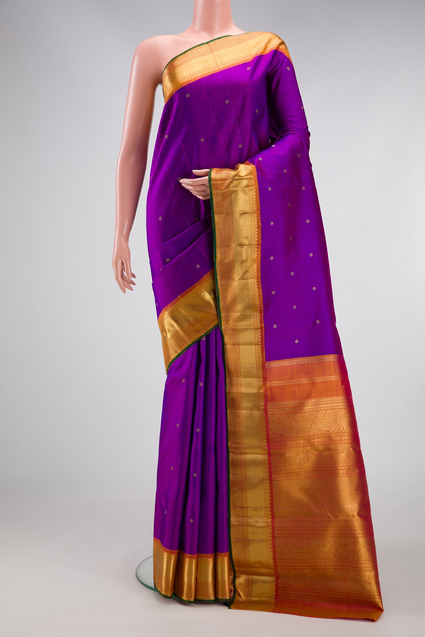 Pure Silk Pure Zari Purple Dual Tone Kanjivaram Saree with Zari Butta on the body and Zari Border.  displayed on a mannequin