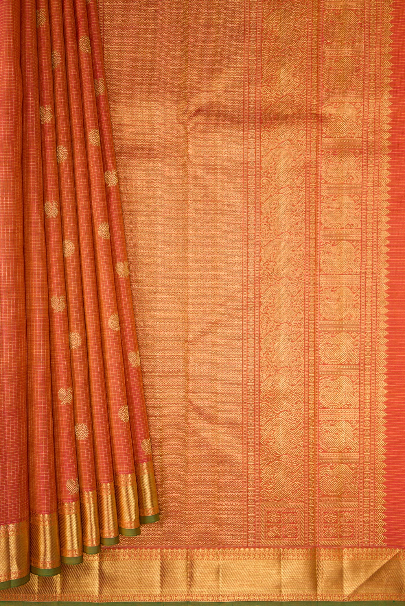 Pleats and pallu of Pure Silk Pure Zari Pinkish Yellow Dual Tone Kanjivaram Saree with Checked design on the body and Zari Border. 