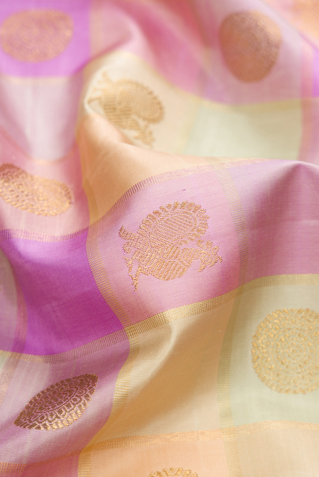 Close up of Pure Silk Pure Zari Multi Color Kanjivaram Saree with Checked design on the body and Zari Border.  displaying folds
