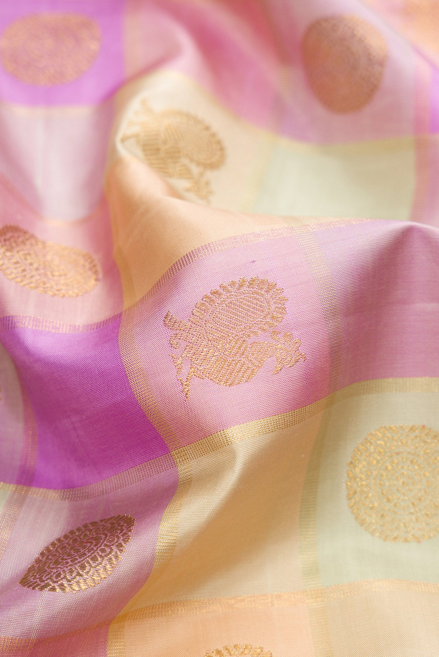 Close up of Pure Silk Pure Zari Multi Color Kanjivaram Saree with Checked design on the body and Zari Border.  displaying folds