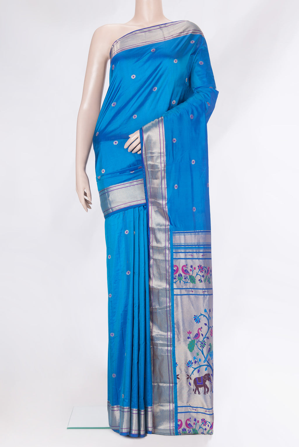 Peacock Blue Blended Paithani Silk Saree with Zari And Thread Butta on the body and Zari Border.  displayed on a mannequin