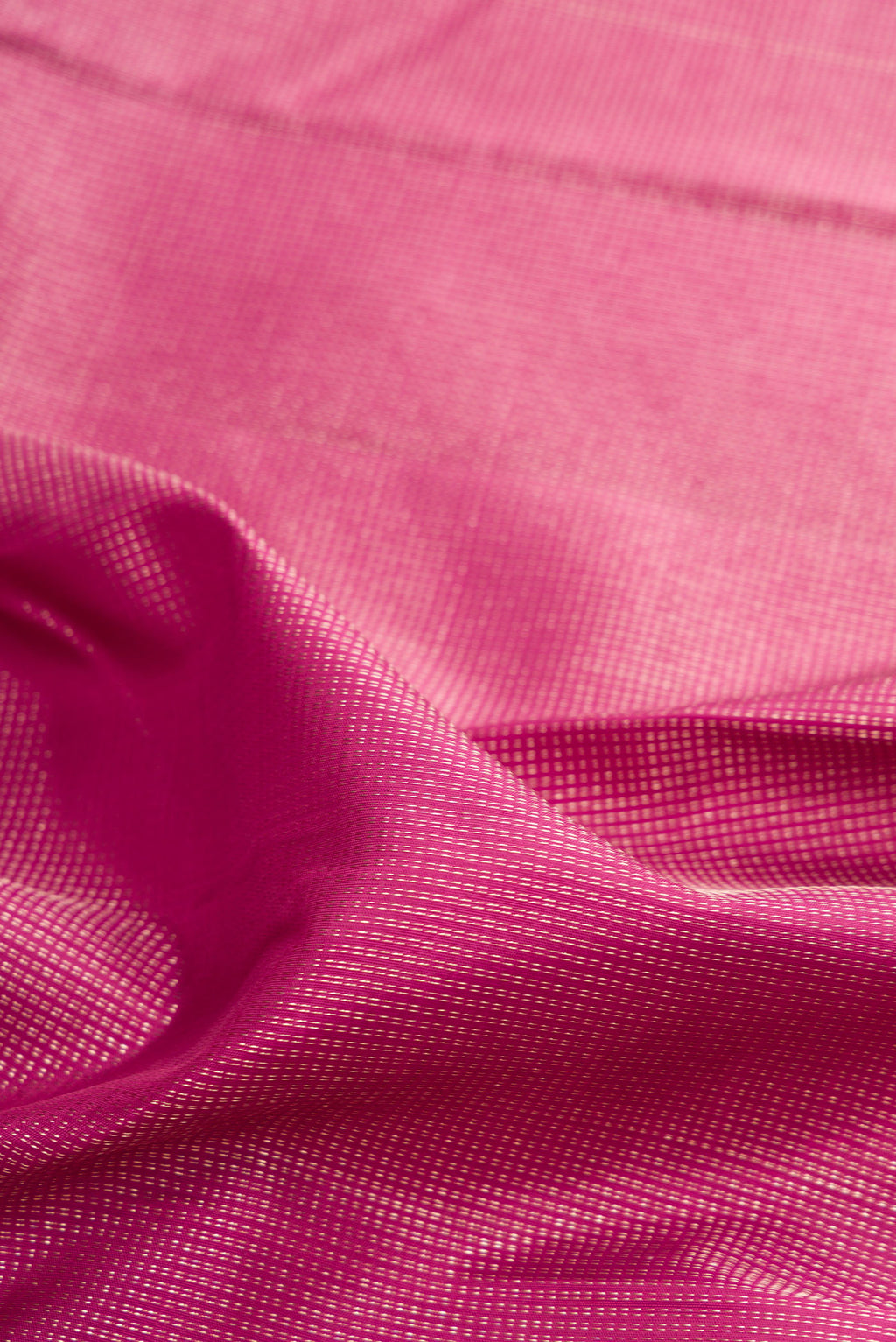 Close up of Light Magenta Kanjivaram Silk Saree with Stripes on the body and Fancy Border.  displaying folds
