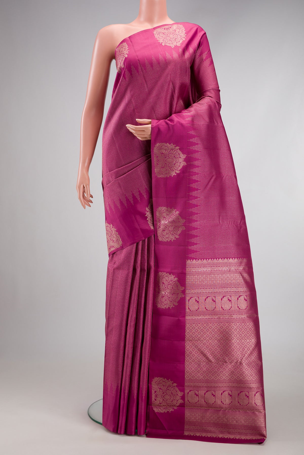 Light Magenta Kanjivaram Silk Saree with Stripes on the body and Fancy Border.  displayed on a mannequin