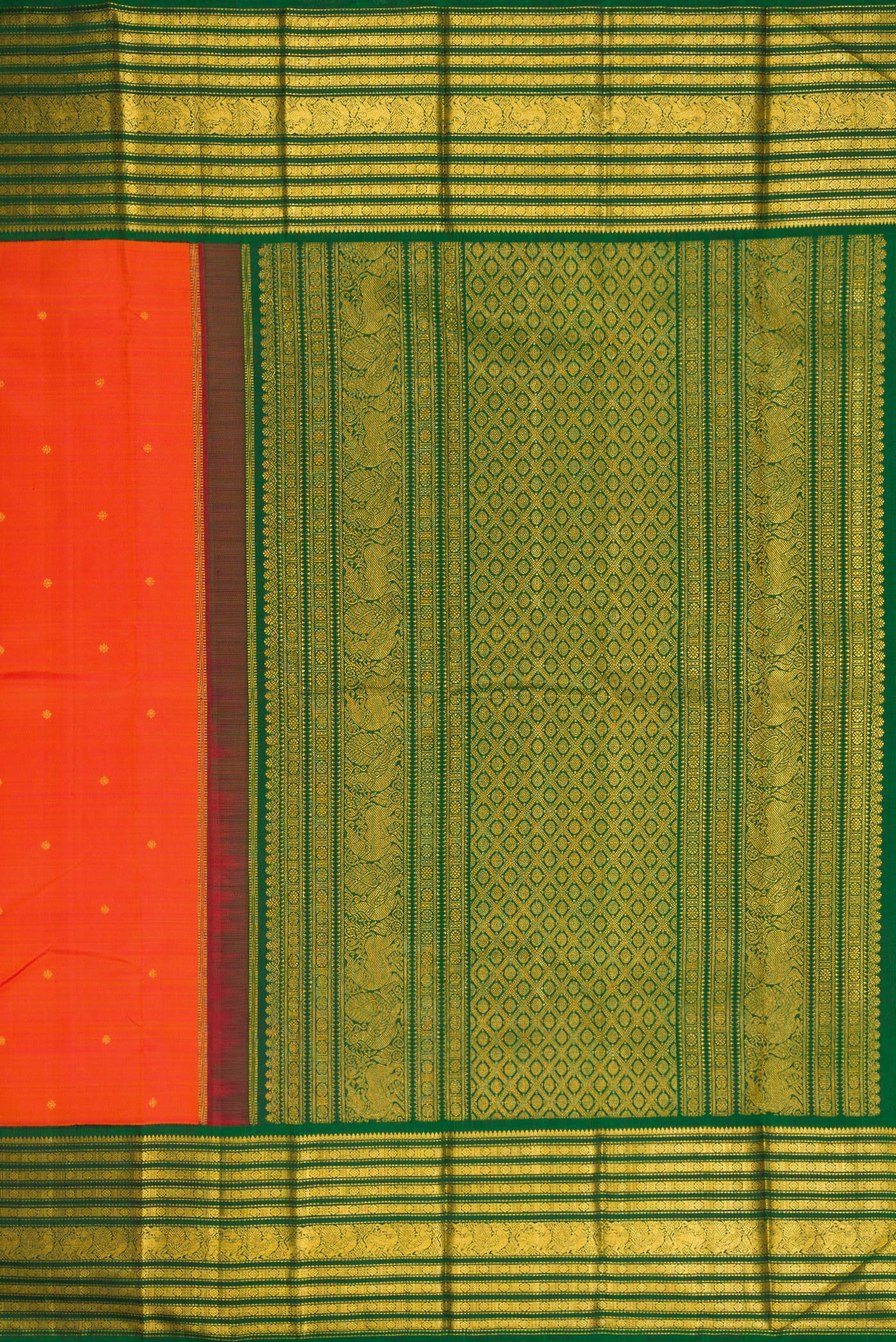Close up image of the pallu of Orange Dual Tone Kanchipuram Silk Saree with Zari Butta on the body and Zari Border. 