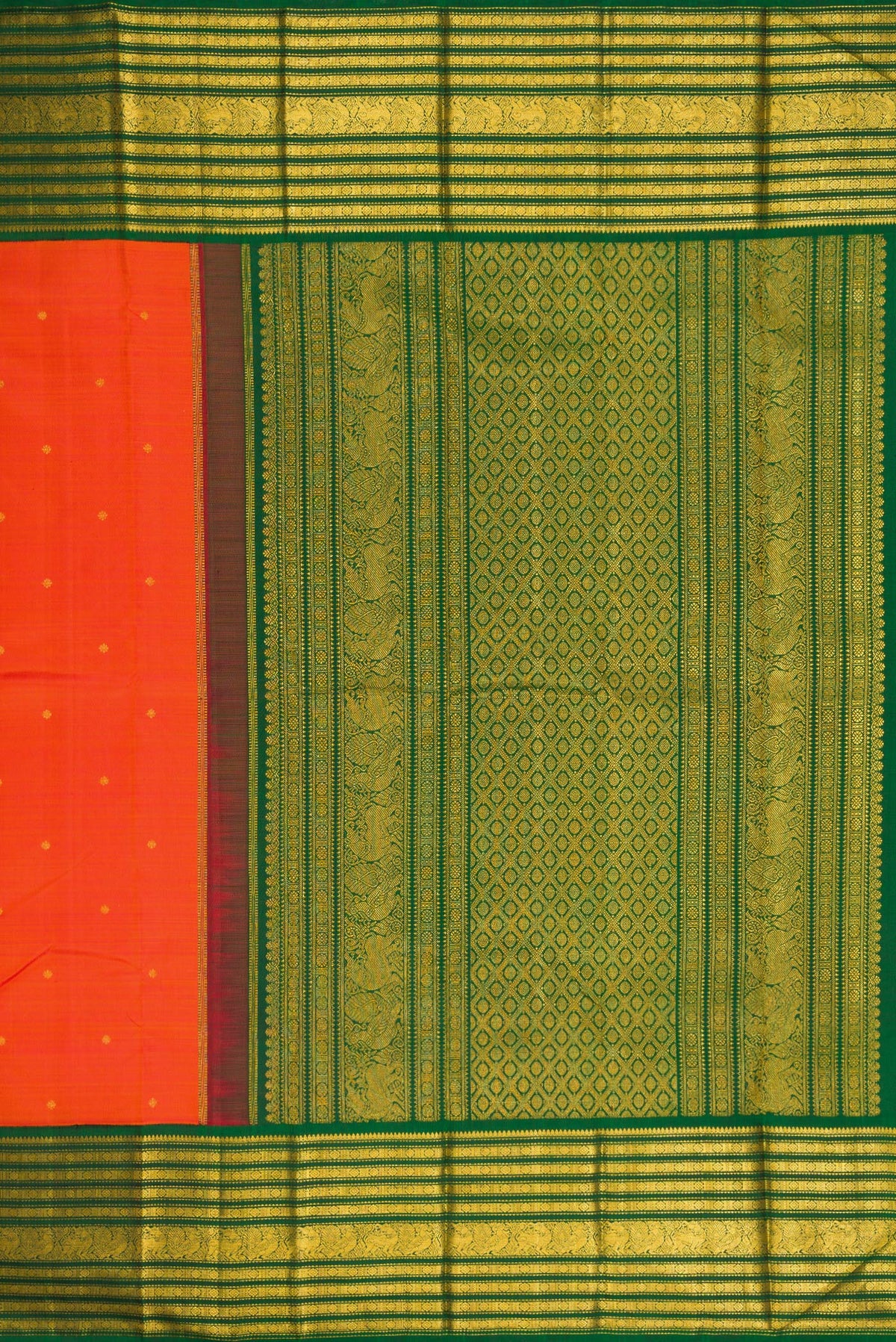 Close up image of the pallu of Orange Dual Tone Kanchipuram Silk Saree with Zari Butta on the body and Zari Border. 