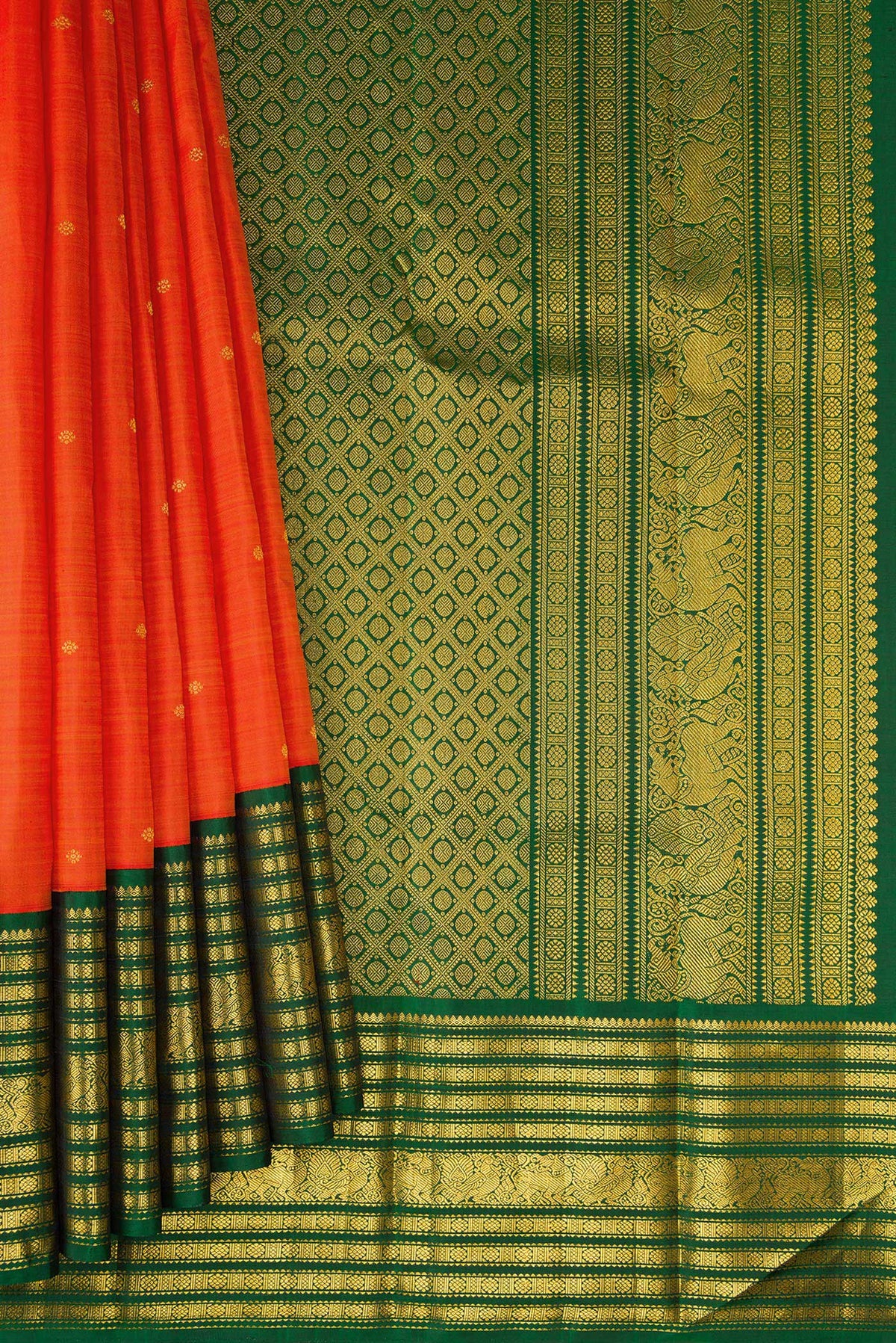 Pleats and pallu of Orange Dual Tone Kanchipuram Silk Saree with Zari Butta on the body and Zari Border. 
