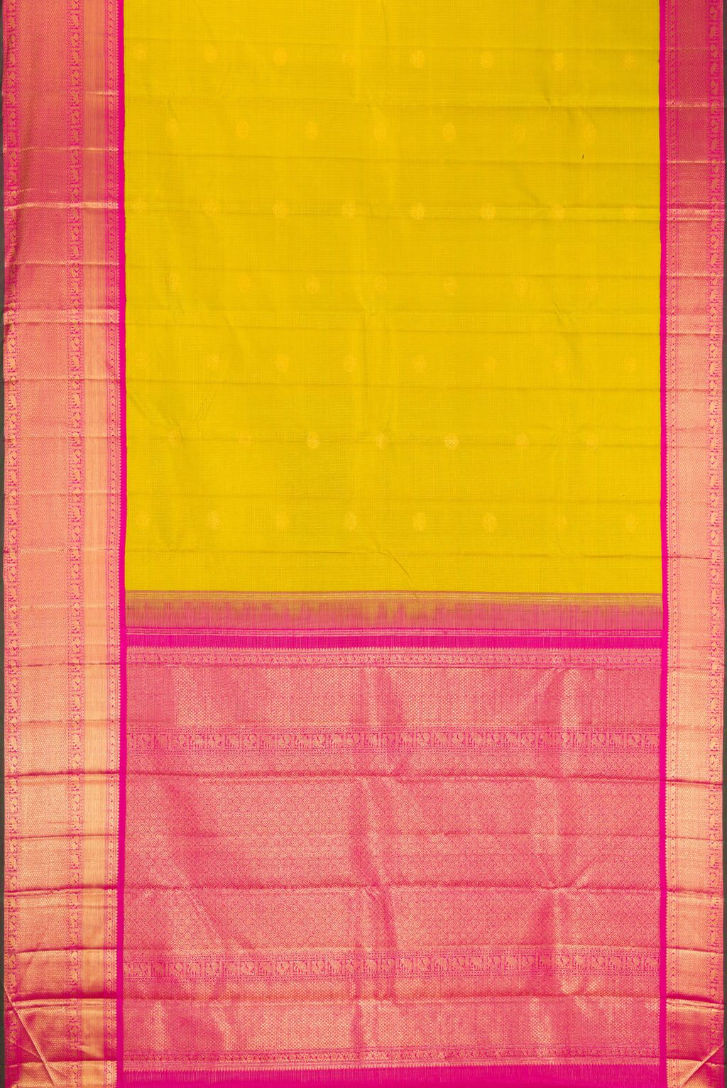Flat view of Parrot Green Kanchipuram Silk Saree with Zari Butta on the body and Zari Border. 