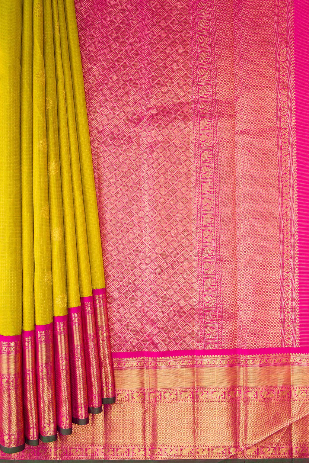 Pleats and pallu of Parrot Green Kanchipuram Silk Saree with Zari Butta on the body and Zari Border. 