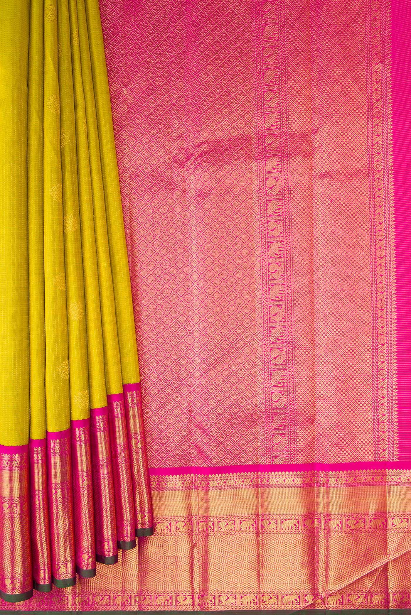 Pleats and pallu of Parrot Green Kanchipuram Silk Saree with Zari Butta on the body and Zari Border. 