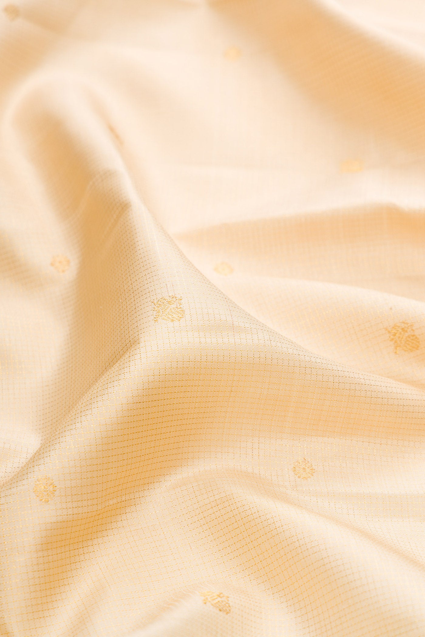 Close up of Sandal Dual Tone Kanchipuram Silk Saree with Checked design on the body and Zari Border.  displaying folds