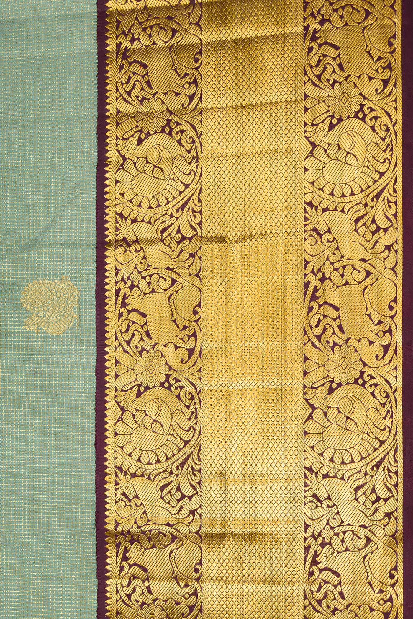 Border image of Green Dual Tone Kanchipuram Silk Saree with Checked design on the body and Fancy Border. 