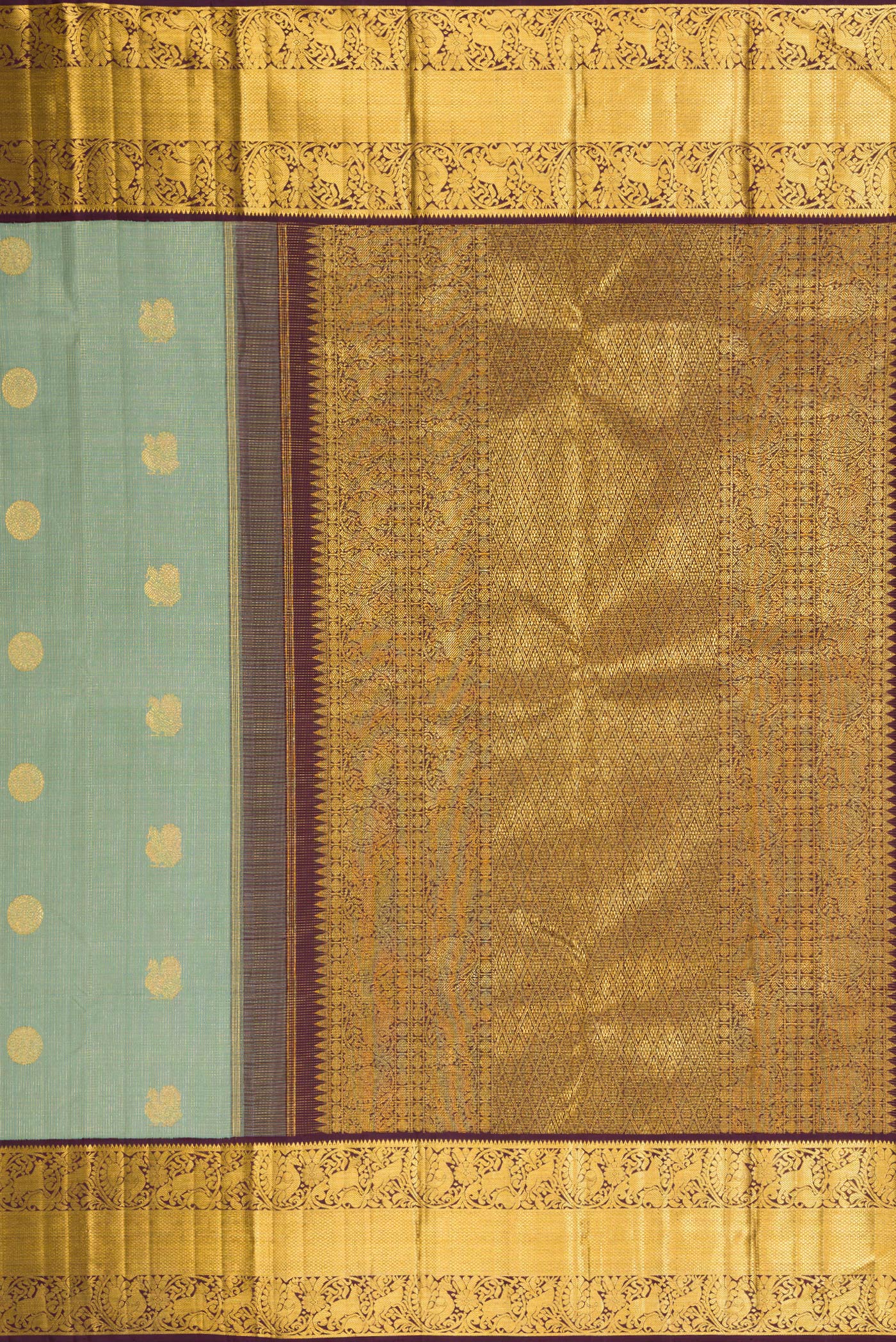 Close up image of the pallu of Green Dual Tone Kanchipuram Silk Saree with Checked design on the body and Fancy Border. 