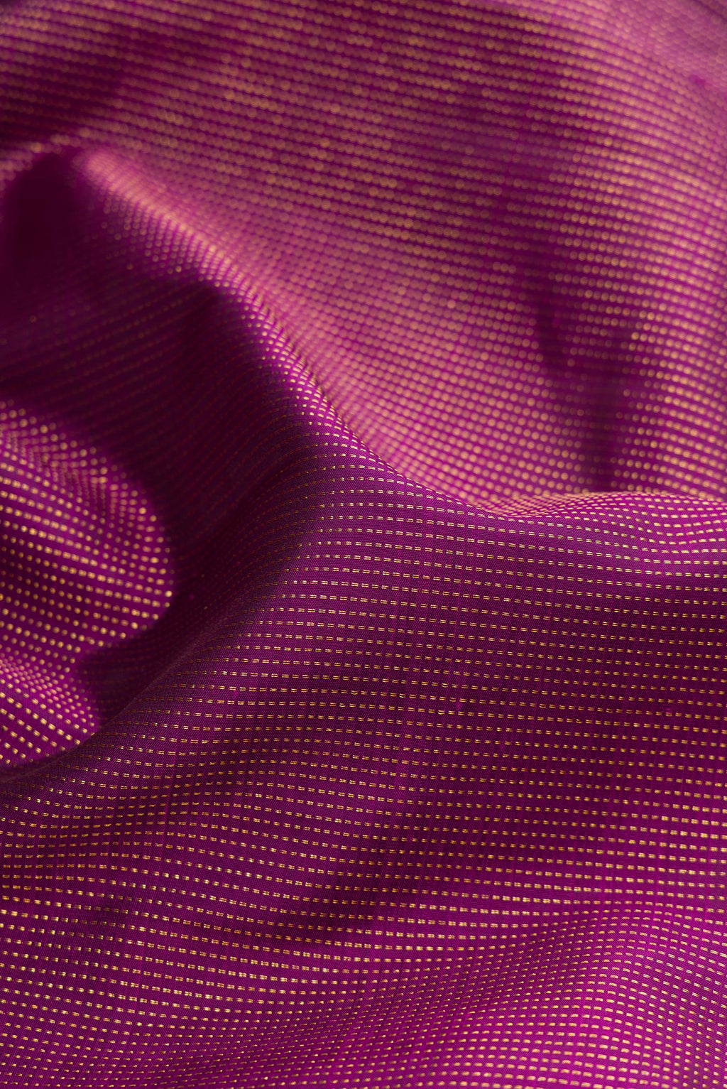 Close up of Purple Kanjivaram Silk Saree with Stripes on the body and Fancy Border.  displaying folds