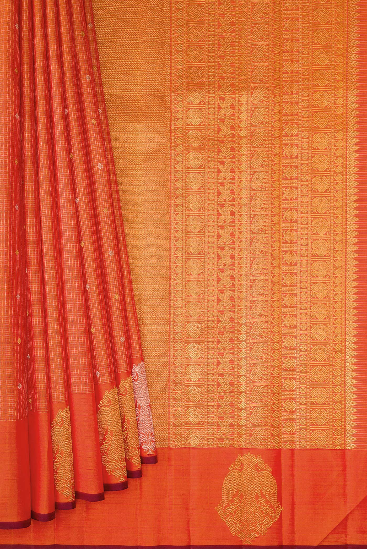 Pleats and pallu of Orange Kanjivaram Silk Saree with Checked design on the body and Fancy Border. 