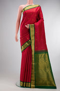 Maroon Kanjivaram Silk Saree with Stripes on the body and Zari Border.  displayed on a mannequin