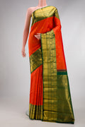 Orange Kanchipuram Silk Saree with Zari Butta on the body and Zari Border.  displayed on a mannequin