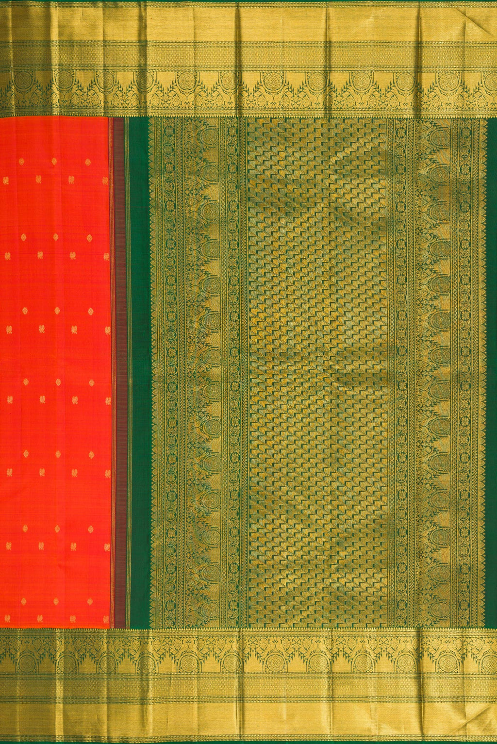 Close up image of the pallu of Orange Kanchipuram Silk Saree with Zari Butta on the body and Zari Border. 