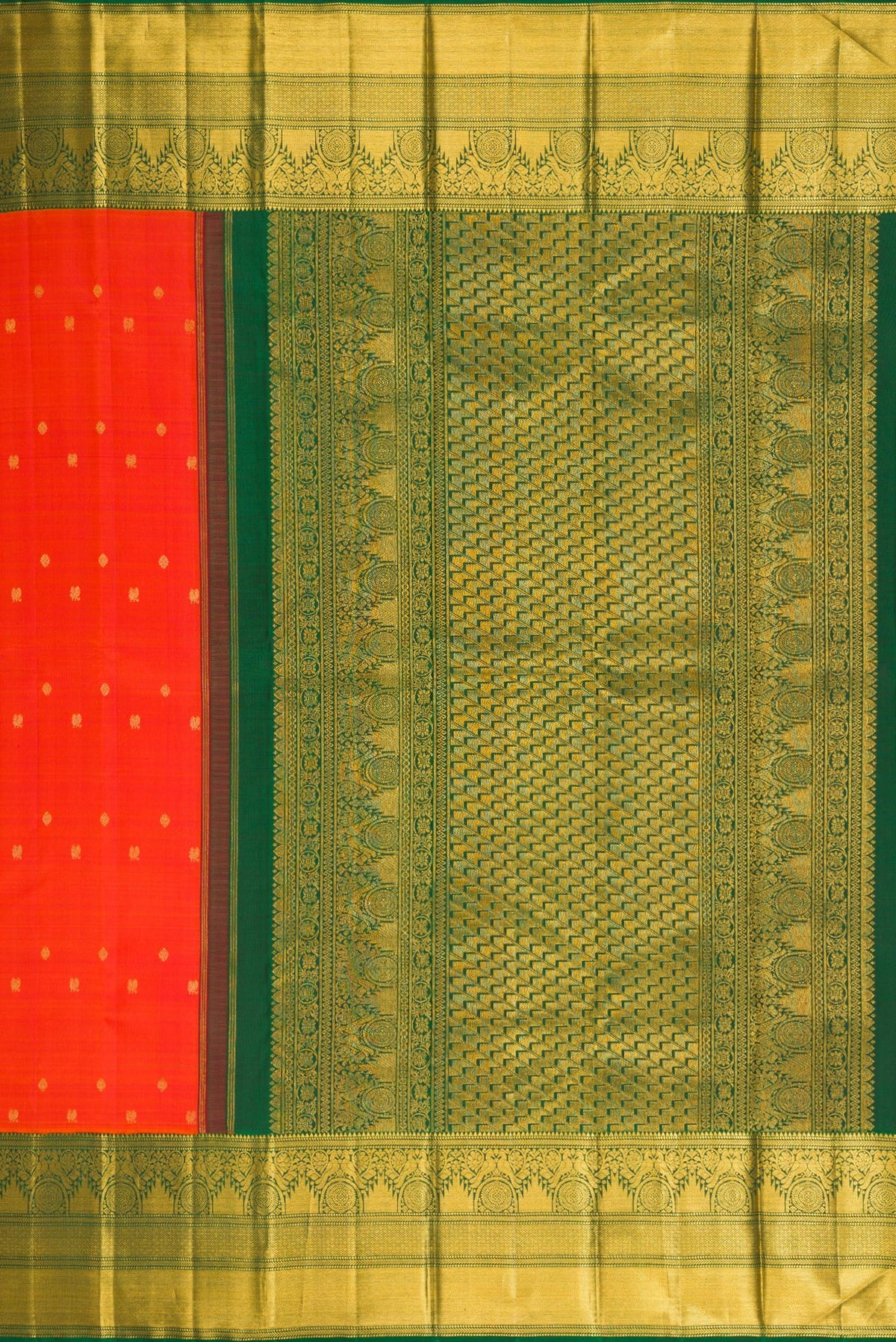 Close up image of the pallu of Orange Kanchipuram Silk Saree with Zari Butta on the body and Zari Border. 