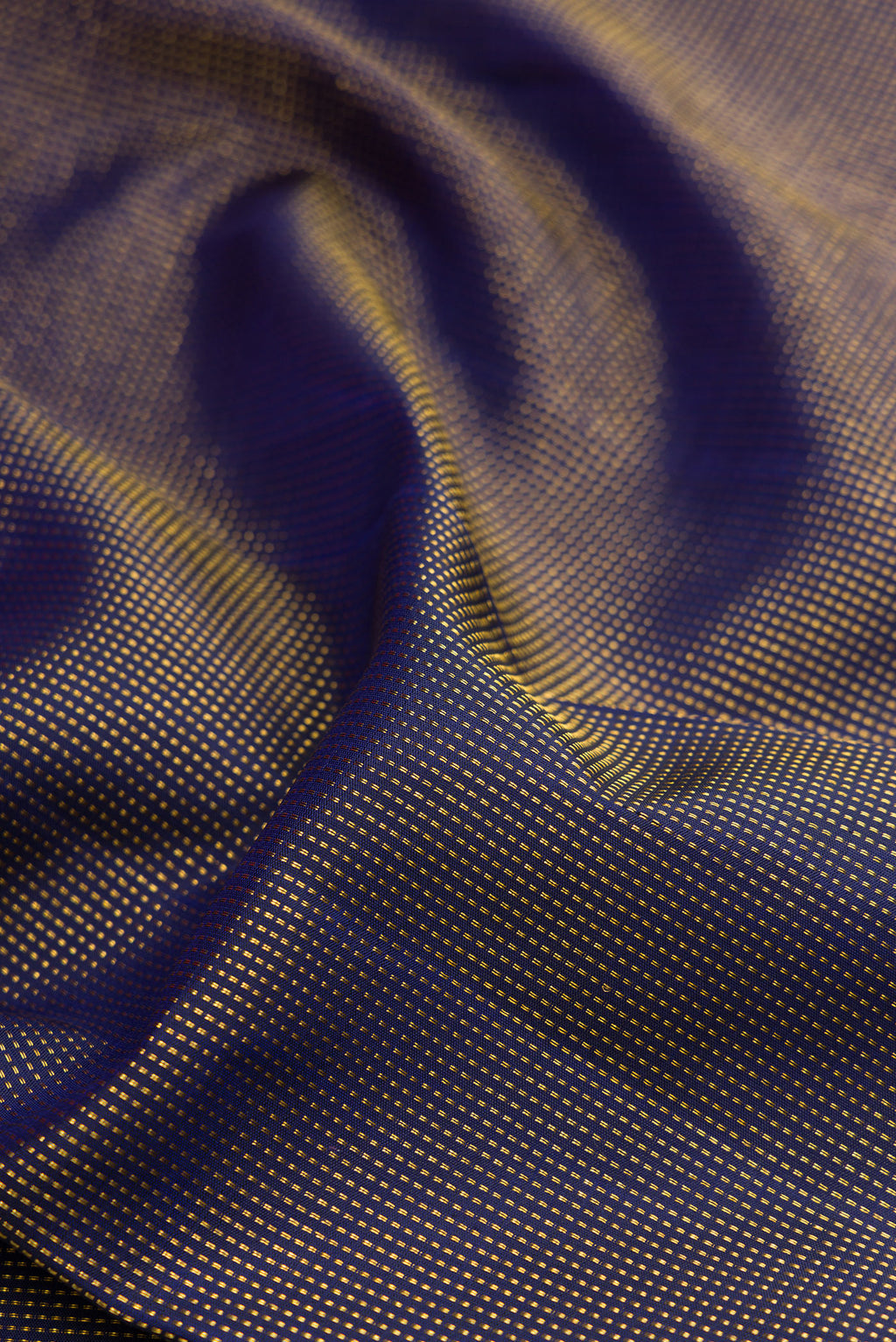 Close up of Navy Blue Kanjivaram Silk Saree with Stripes on the body and Fancy Border.  displaying folds