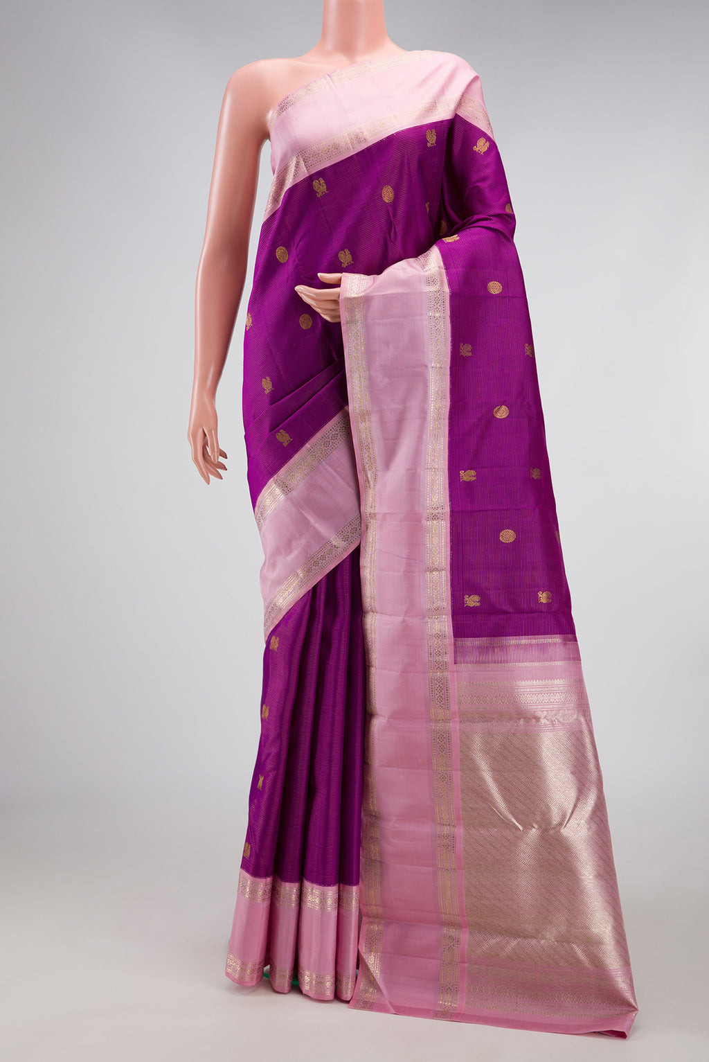 Purple Dual Tone Kanchipuram Silk Saree with Zari Butta on the body and Zari Border.  displayed on a mannequin