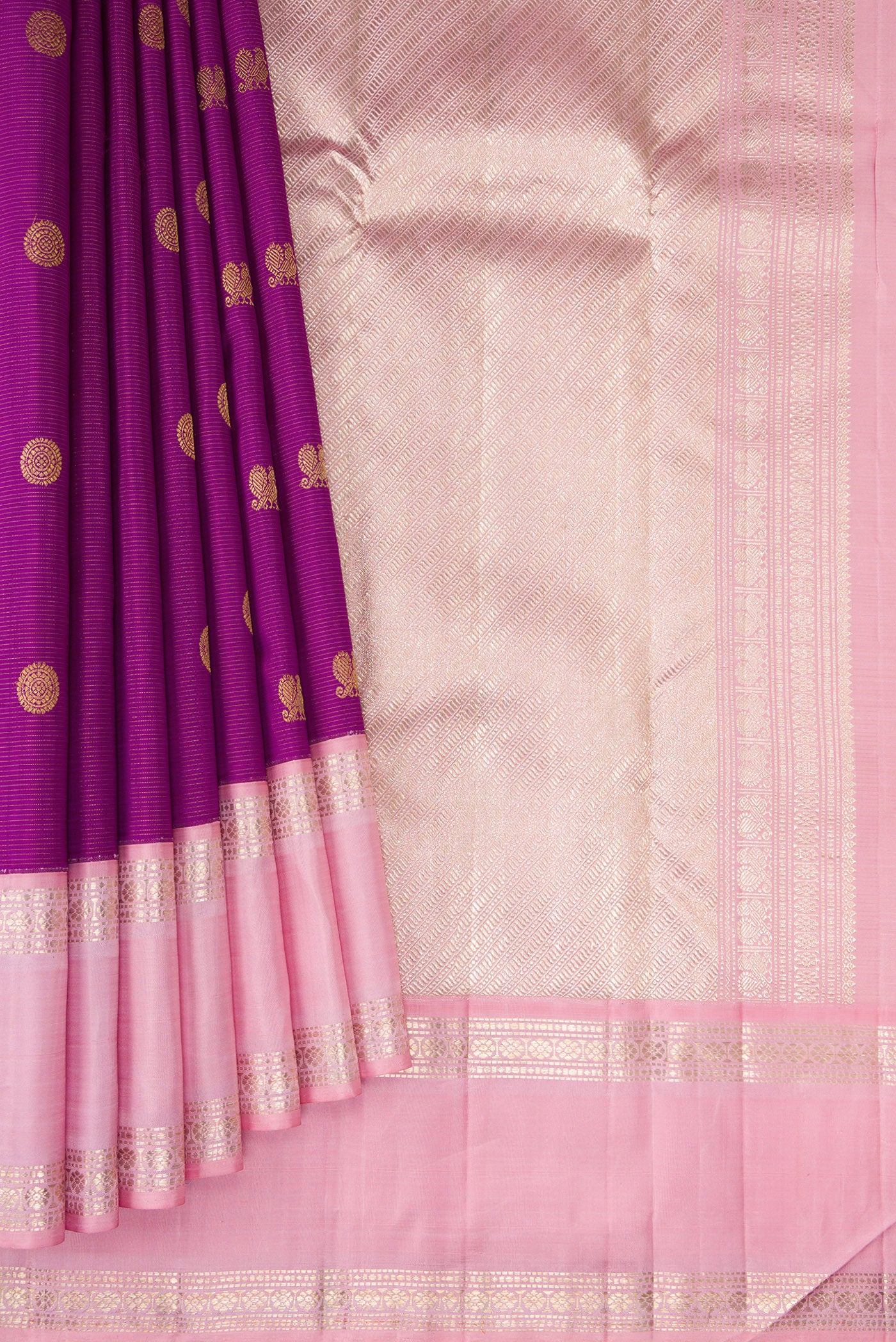 Pleats and pallu of Purple Dual Tone Kanchipuram Silk Saree with Zari Butta on the body and Zari Border. 