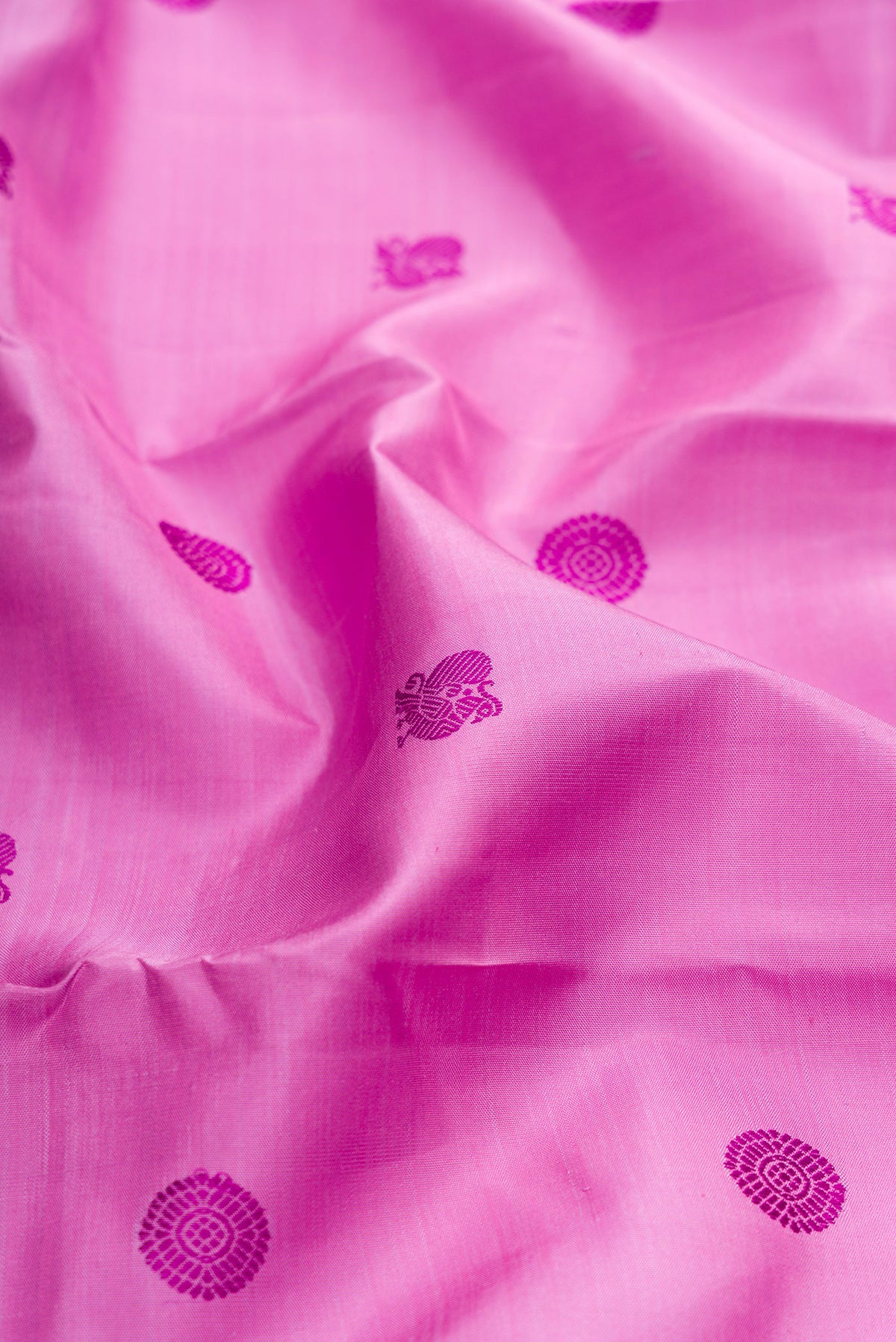 Close up of Pure Silk Pure Zari Lavender Kanchipuram Saree with Thread Butta on the body and Zari Border.  displaying folds