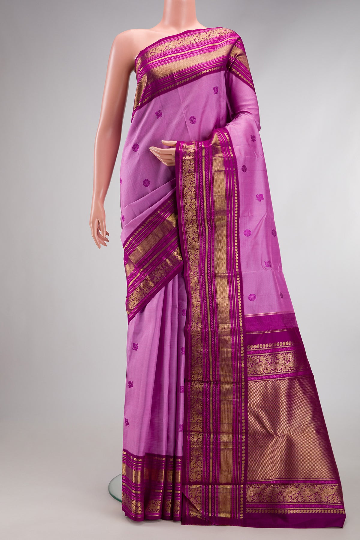 Pure Silk Pure Zari Lavender Kanchipuram Saree with Thread Butta on the body and Zari Border.  displayed on a mannequin