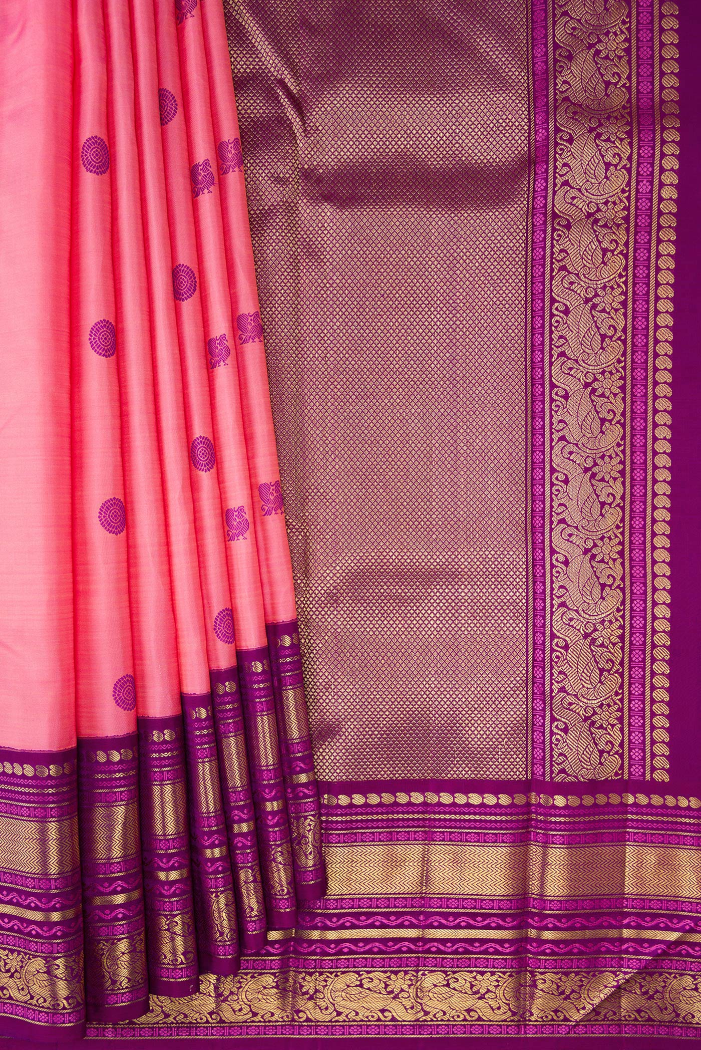 Pleats and pallu of Pure Silk Pure Zari Pink Kanchipuram Saree with Thread Butta on the body and Zari Border. 