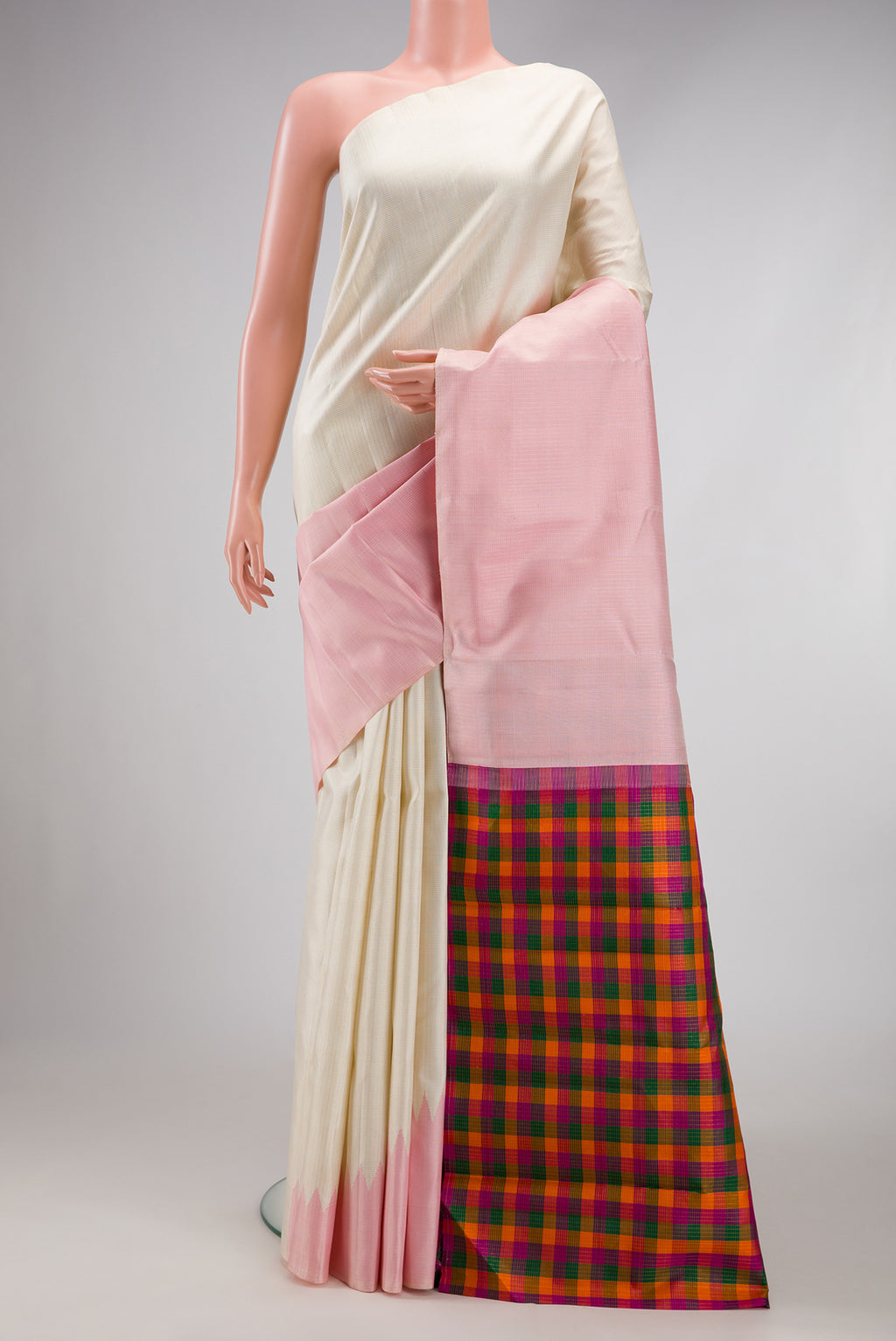 Off White Kanchipuram Silk Saree with Checked design on the body and Rising Temple Border.  displayed on a mannequin