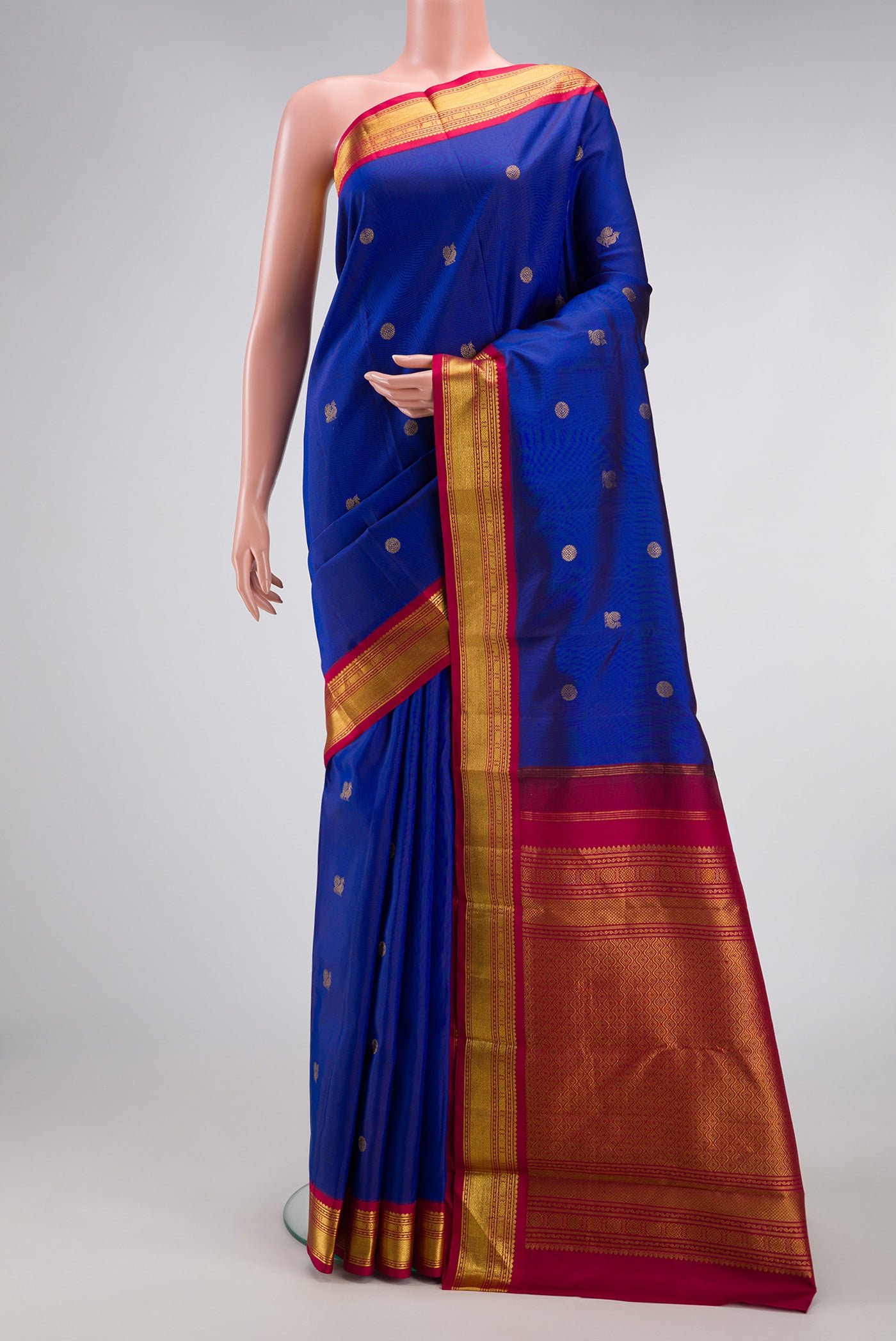 Royal Blue Dual Tone Kanjivaram Silk Saree with Zari Butta on the body and Zari Border.  displayed on a mannequin