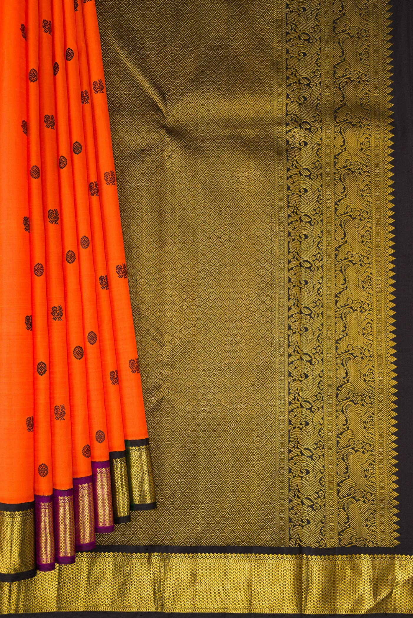 Pleats and pallu of Orange Kanjivaram Silk Saree with Thread Butta on the body and Zari Border. 