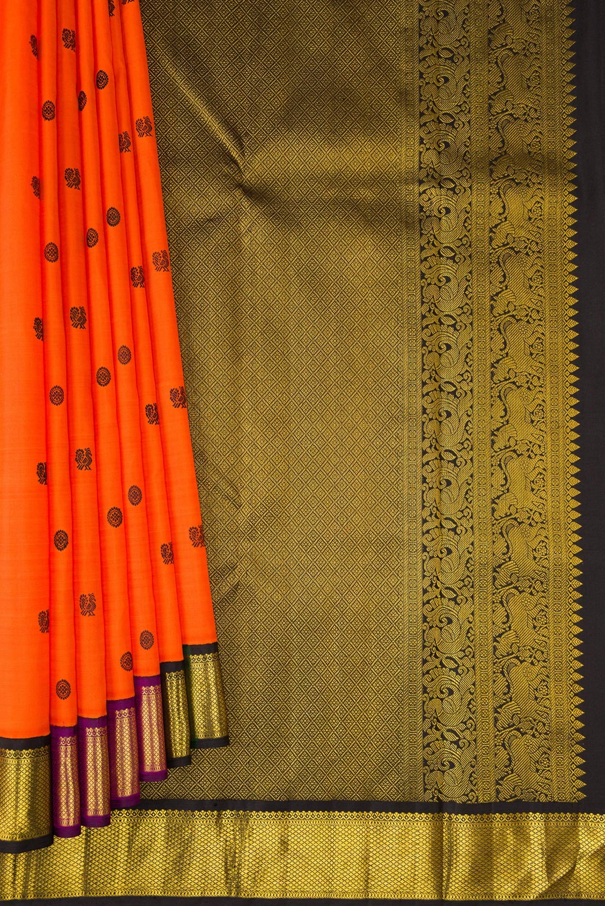 Pleats and pallu of Orange Kanjivaram Silk Saree with Thread Butta on the body and Zari Border. 