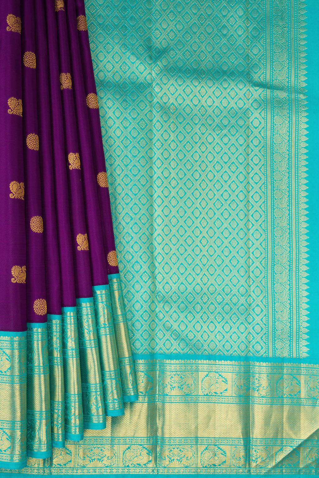 Pleats and pallu of Purple Kanjivaram Silk Saree with Zari Butta on the body and Zari Border. 