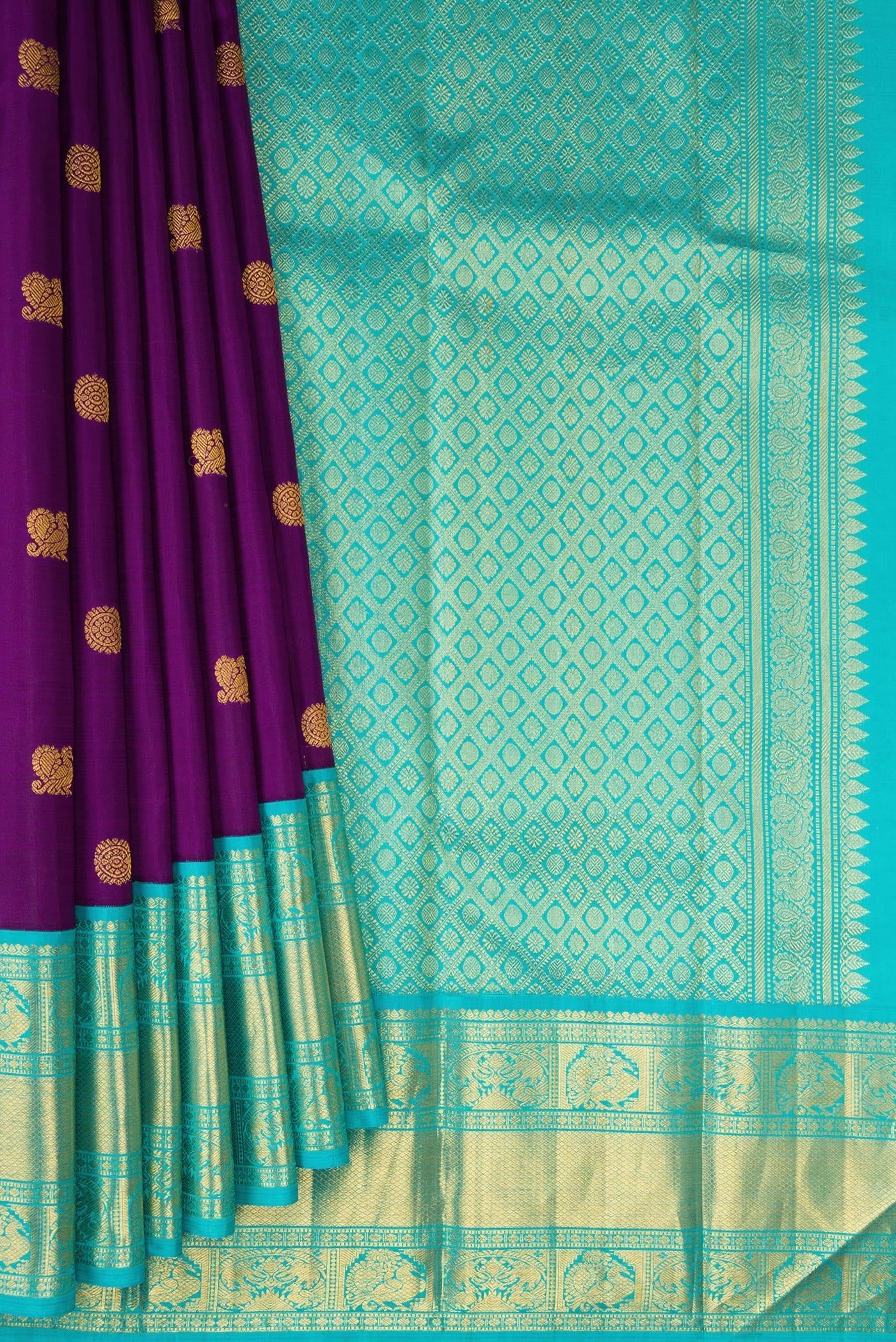 Pleats and pallu of Purple Kanjivaram Silk Saree with Zari Butta on the body and Zari Border. 