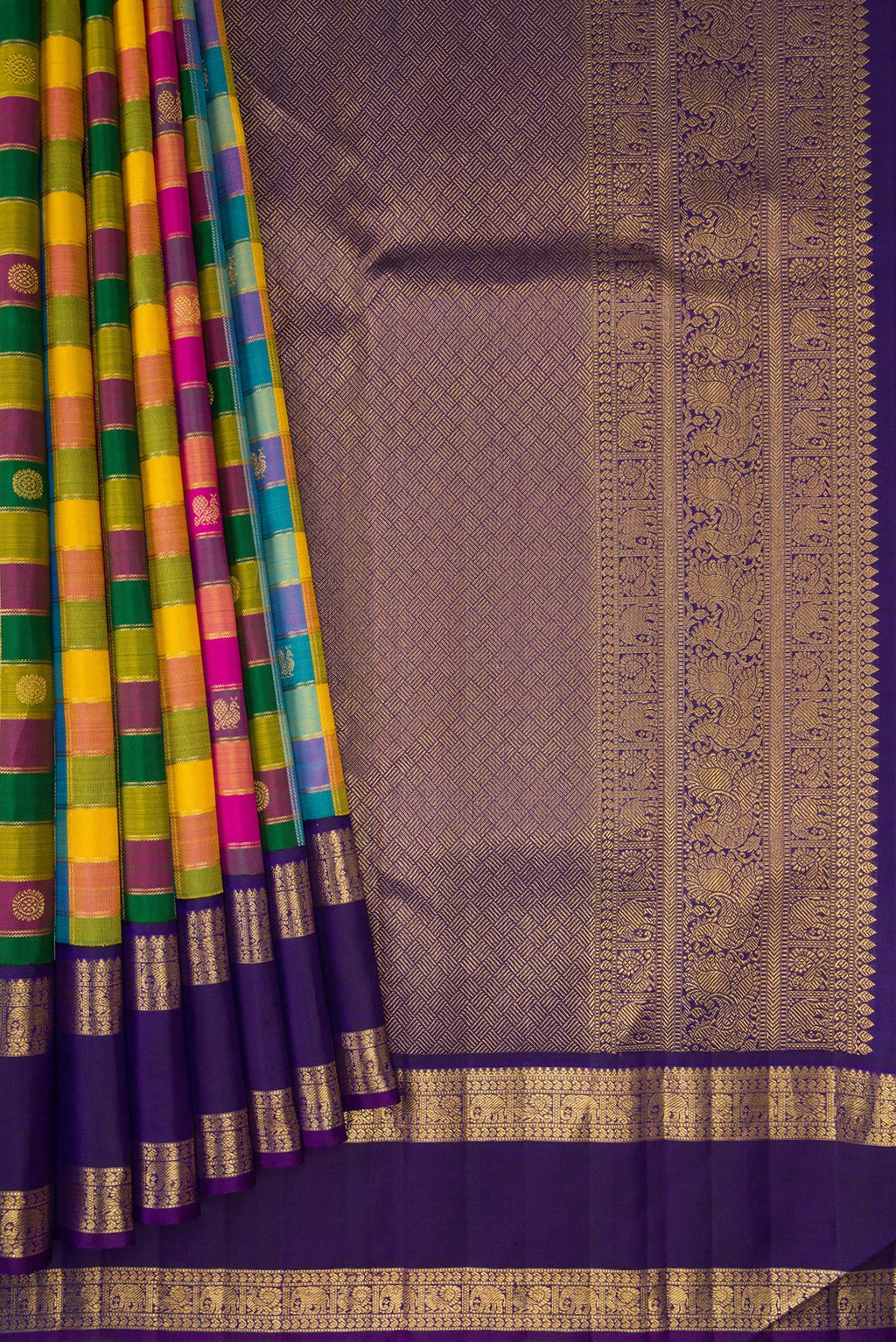 Pleats and pallu of Multi Color Kanchipuram Silk Saree with Checked design on the body and Zari Border. 