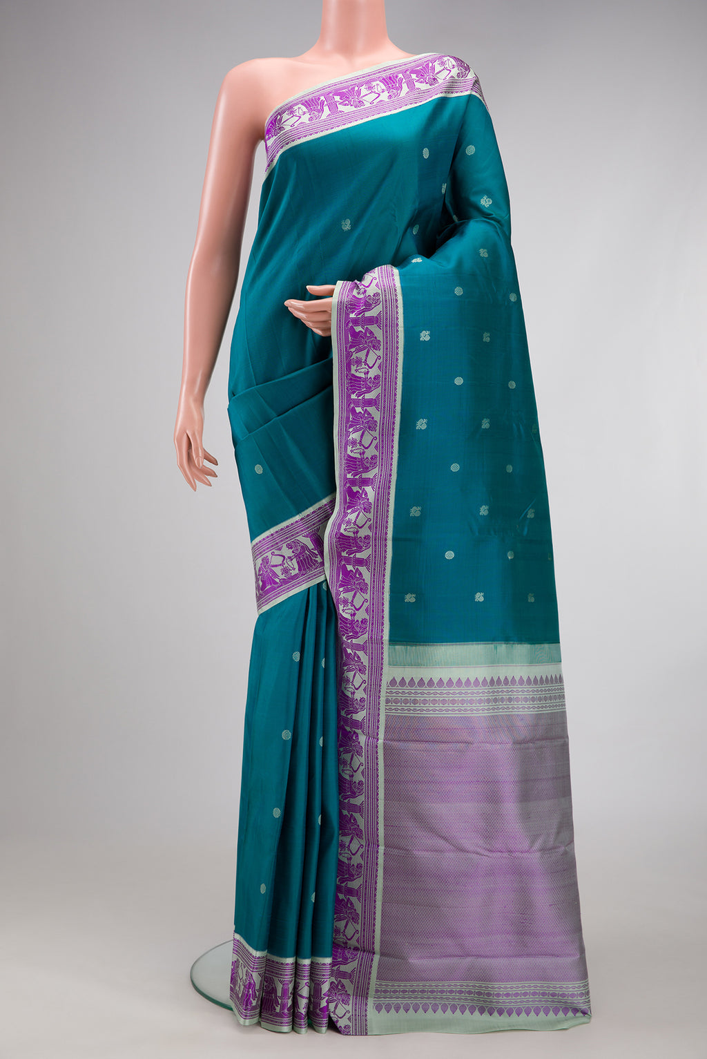 Blue Kanjivaram Silk Saree with Thread Butta on the body and Thread Border.  displayed on a mannequin
