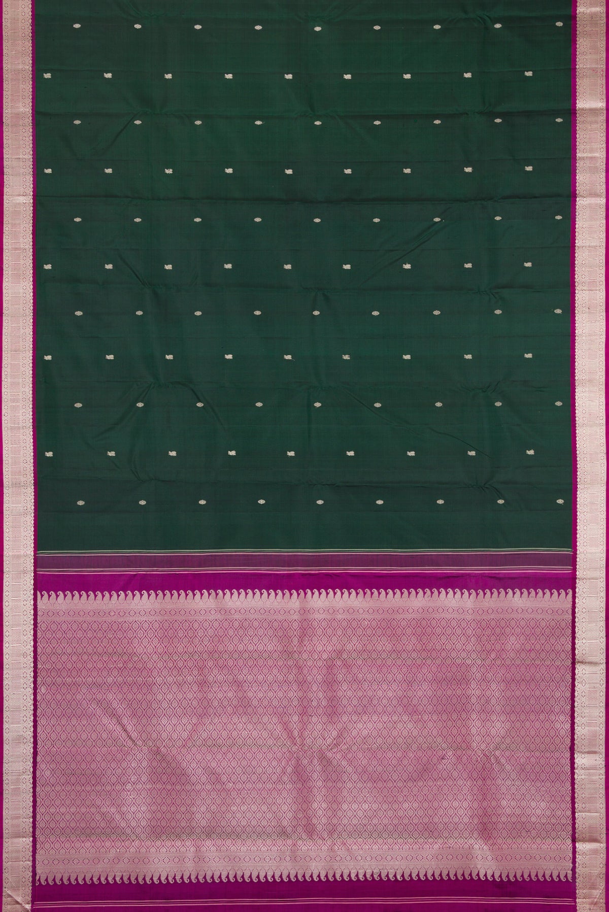 Flat view of Bottle Green Kanchipuram Silk Saree with Thread Butta on the body and Thread Border. 