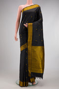 Black Kanchipuram Silk Saree with Thread Butta on the body and Thread Border.  displayed on a mannequin