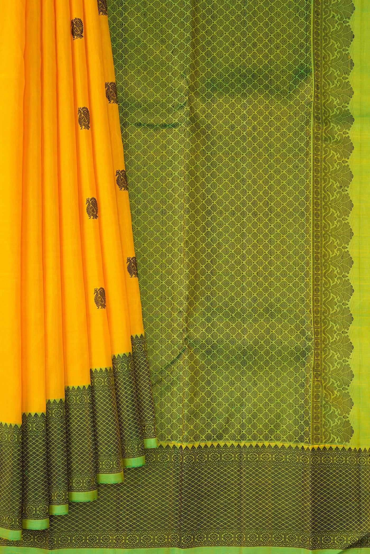 Pleats and pallu of Yellow Kanjivaram Silk Saree with Thread Butta on the body and Thread Border. 