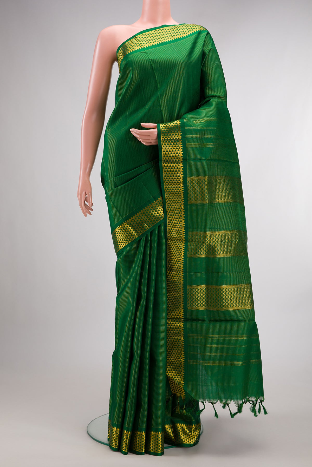 Pure Silk Green Kanchipuram Nine Yards Saree with Stripes on the body and Zari Border.  displayed on a mannequin