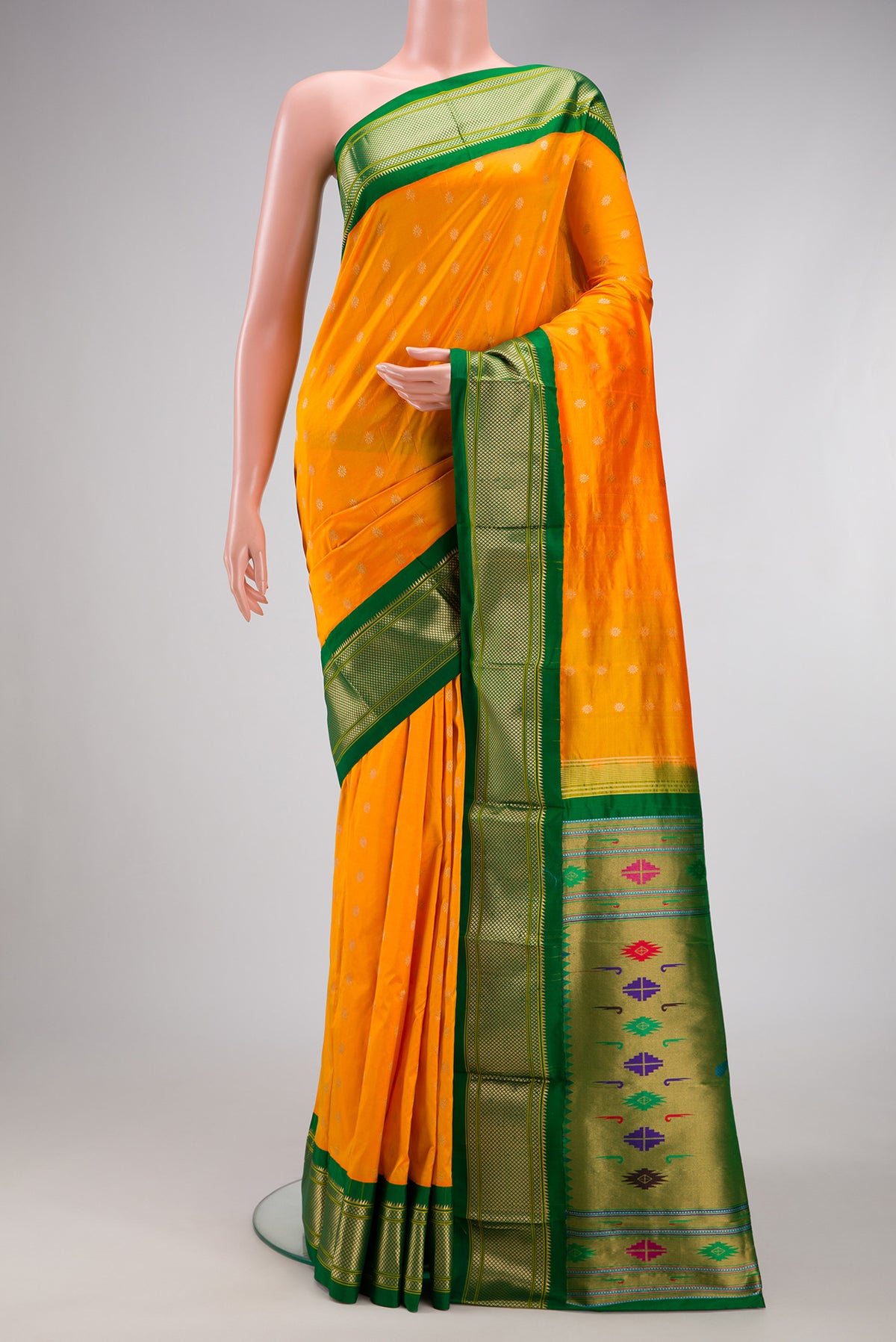 Yellow Paithani Silk Saree with Zari Butta on the body and Zari Border.  displayed on a mannequin
