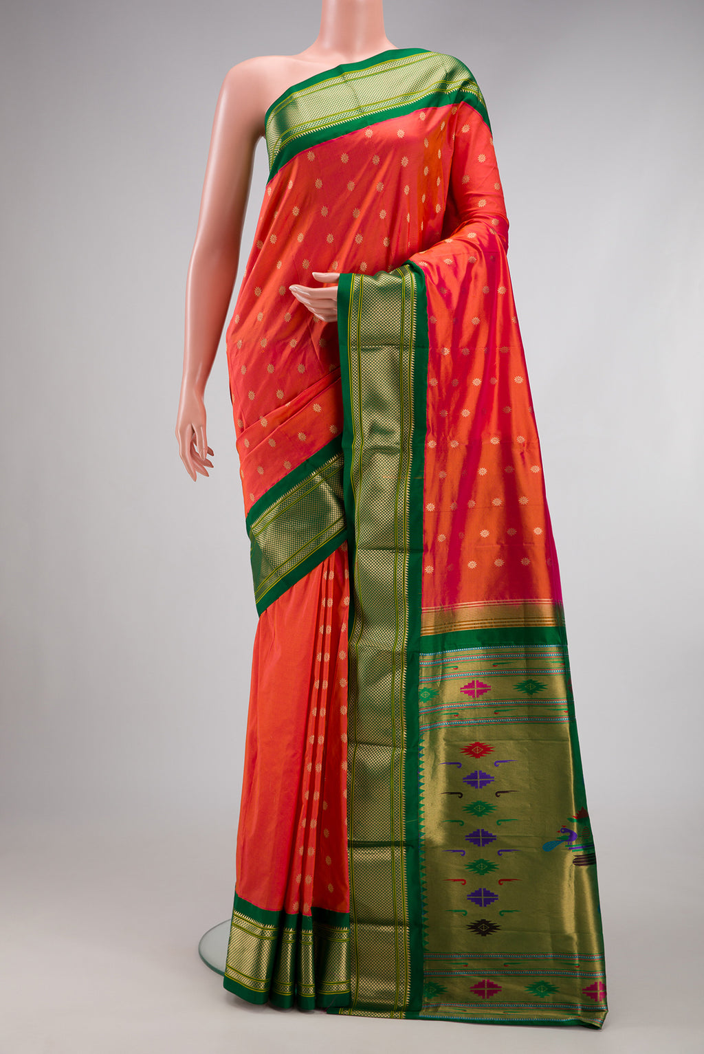 Coral Dual Tone Paithani Silk Saree with Zari Butta on the body and Zari Border.  displayed on a mannequin