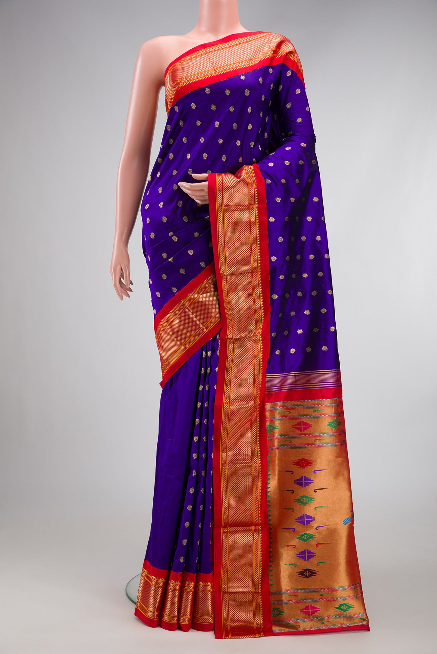 Royal Blue Paithani Silk Saree with Zari Butta on the body and Zari Border.  displayed on a mannequin