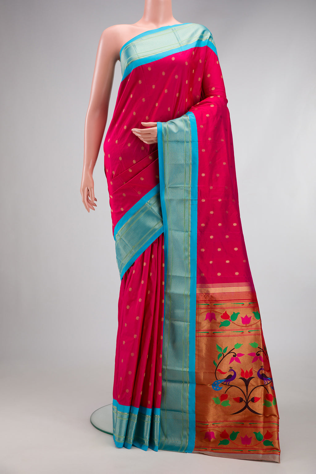Dark Pink Paithani Silk Saree with Zari Butta on the body and Zari Border.  displayed on a mannequin