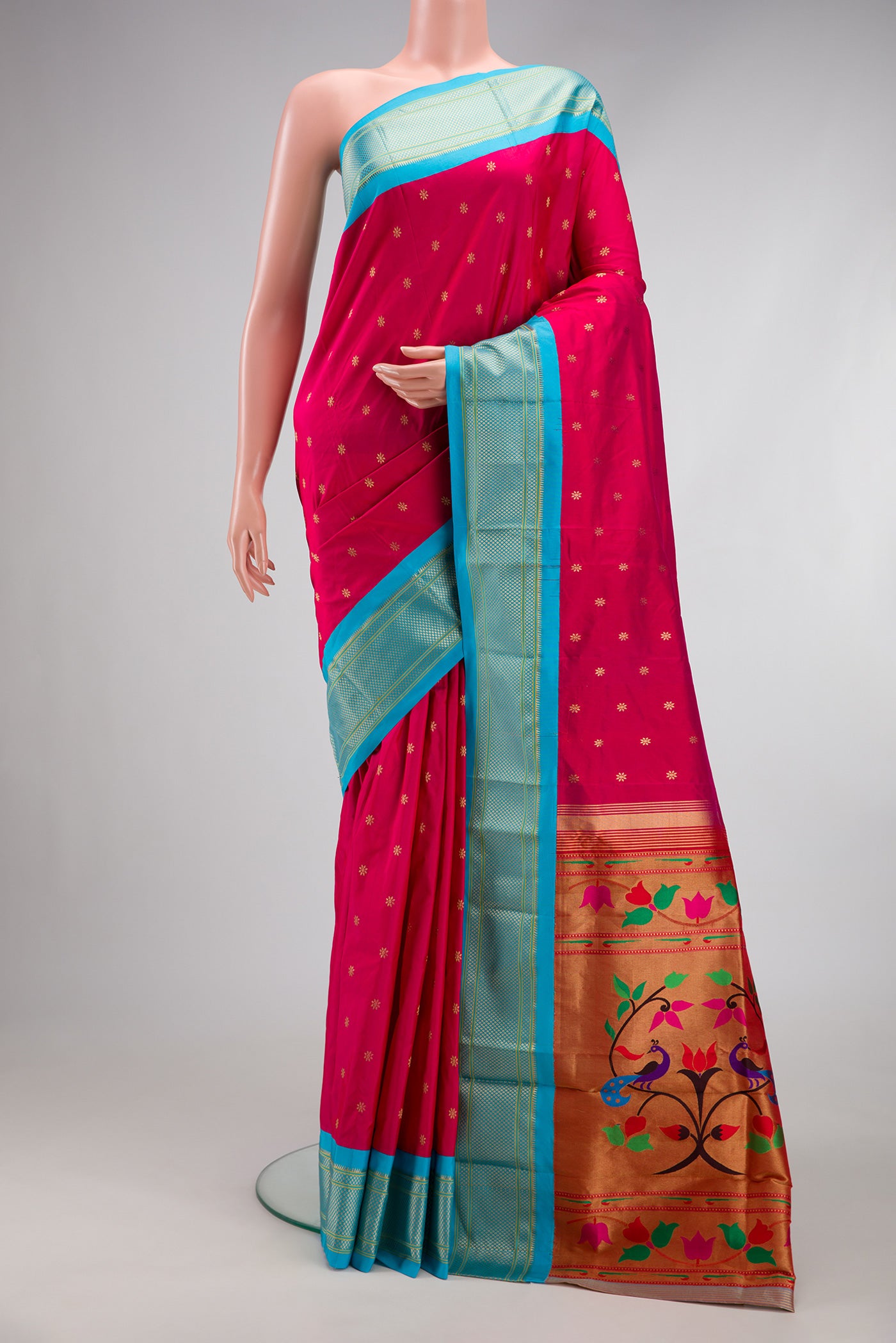 Dark Pink Paithani Silk Saree with Zari Butta on the body and Zari Border.  displayed on a mannequin