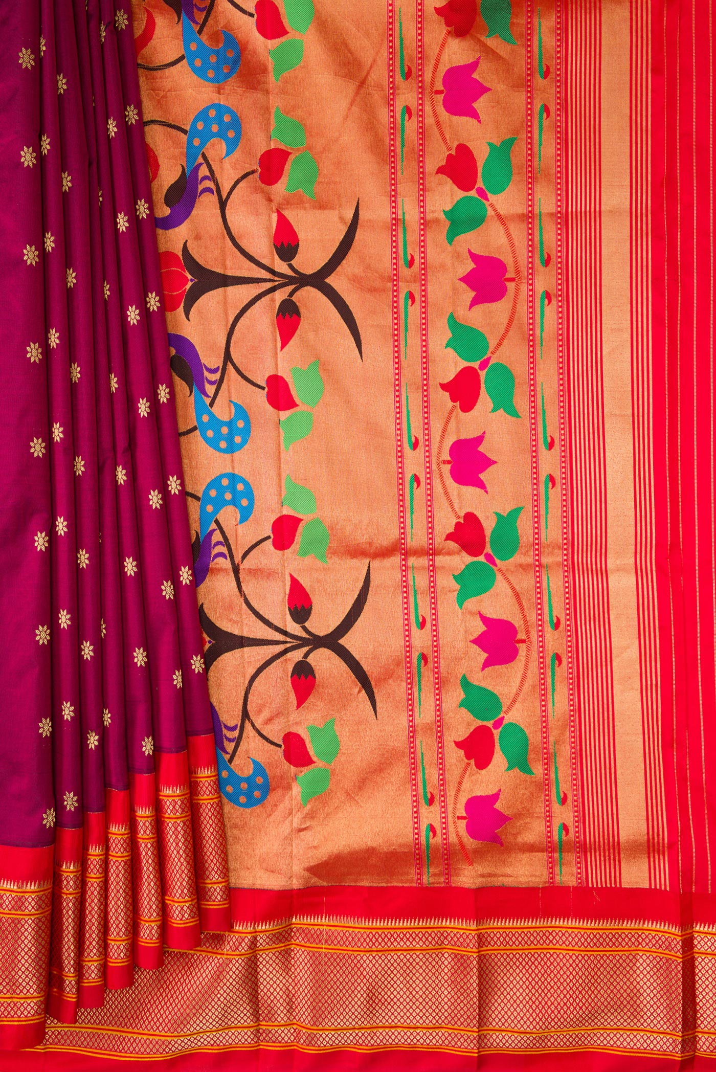 Pleats and pallu of Magenta Paithani Silk Saree with Zari Butta on the body and Zari Border. 